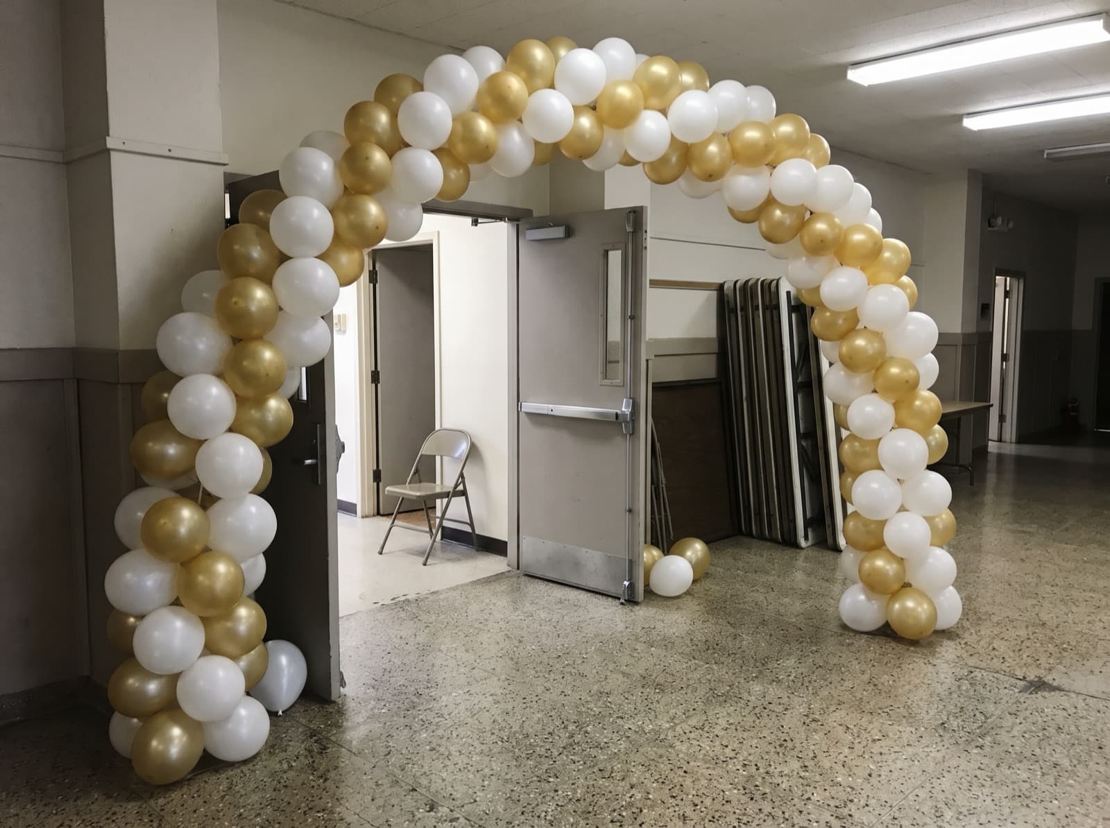 Balloon columns joined by an arch at a parish hall entrance
