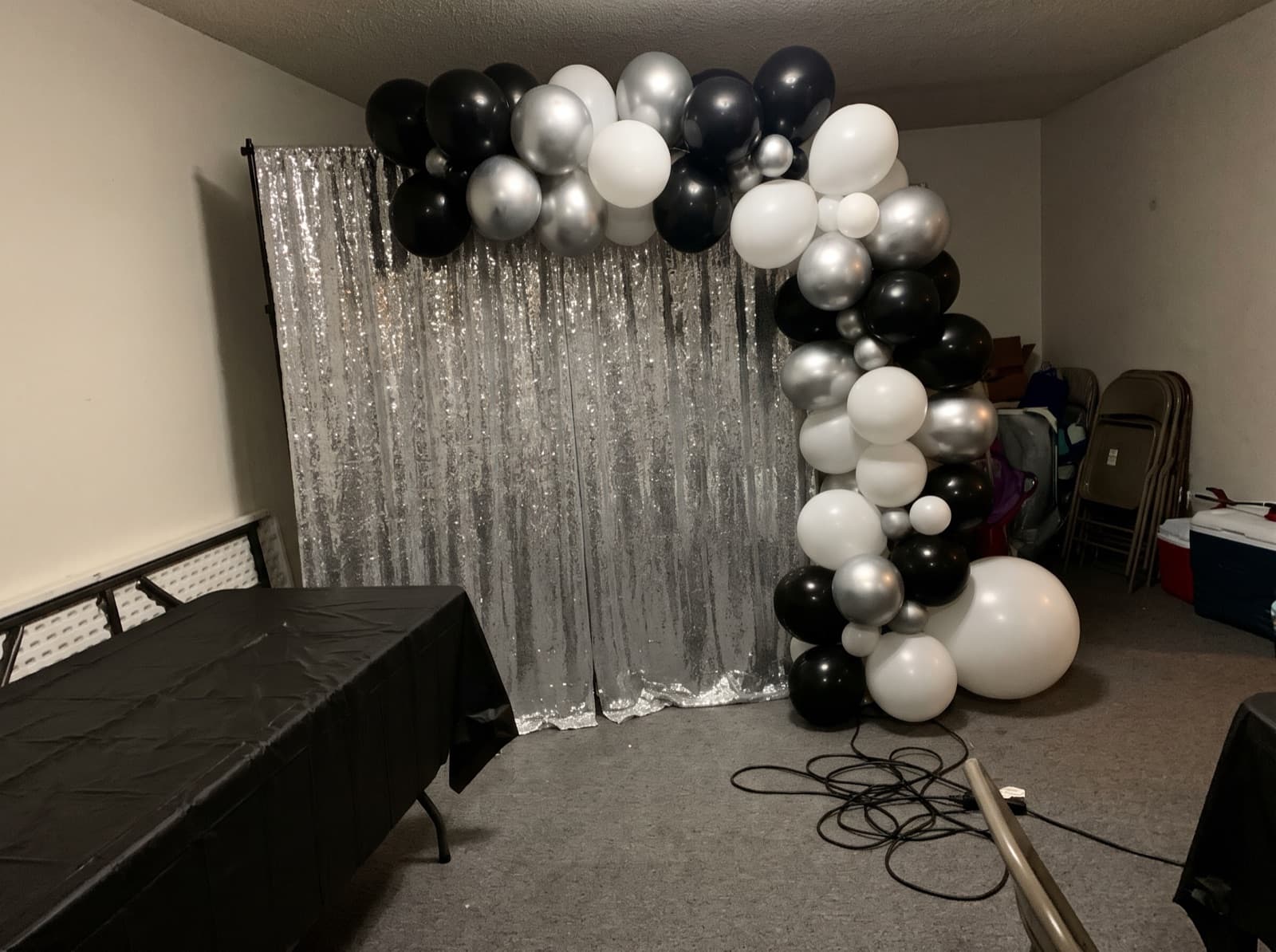 Balloon garland over a silver shimmer wall