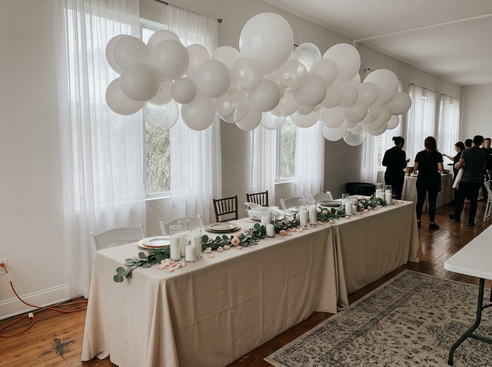 Balloon cloud over a sweetheart table