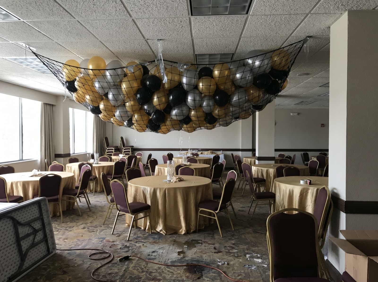 Balloon drop net overhead before a countdown