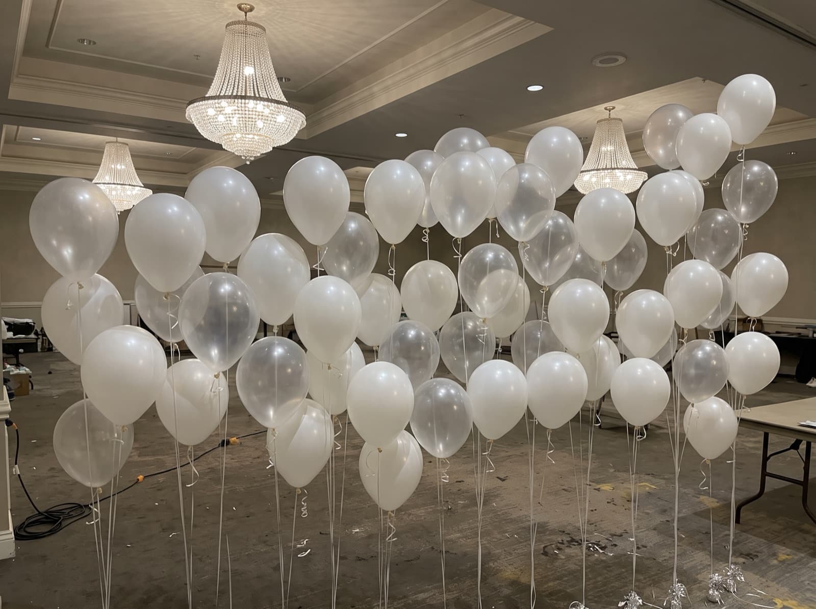 Floating helium balloon wall with ribbons